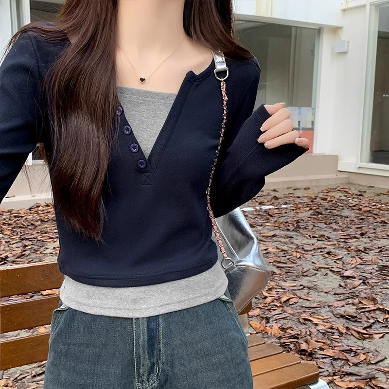 Hot girl style straight shoulder long sleeve T-shirt women's early autumn design sense splicing fake two slim V-neck contrasting colors and versatile clothes