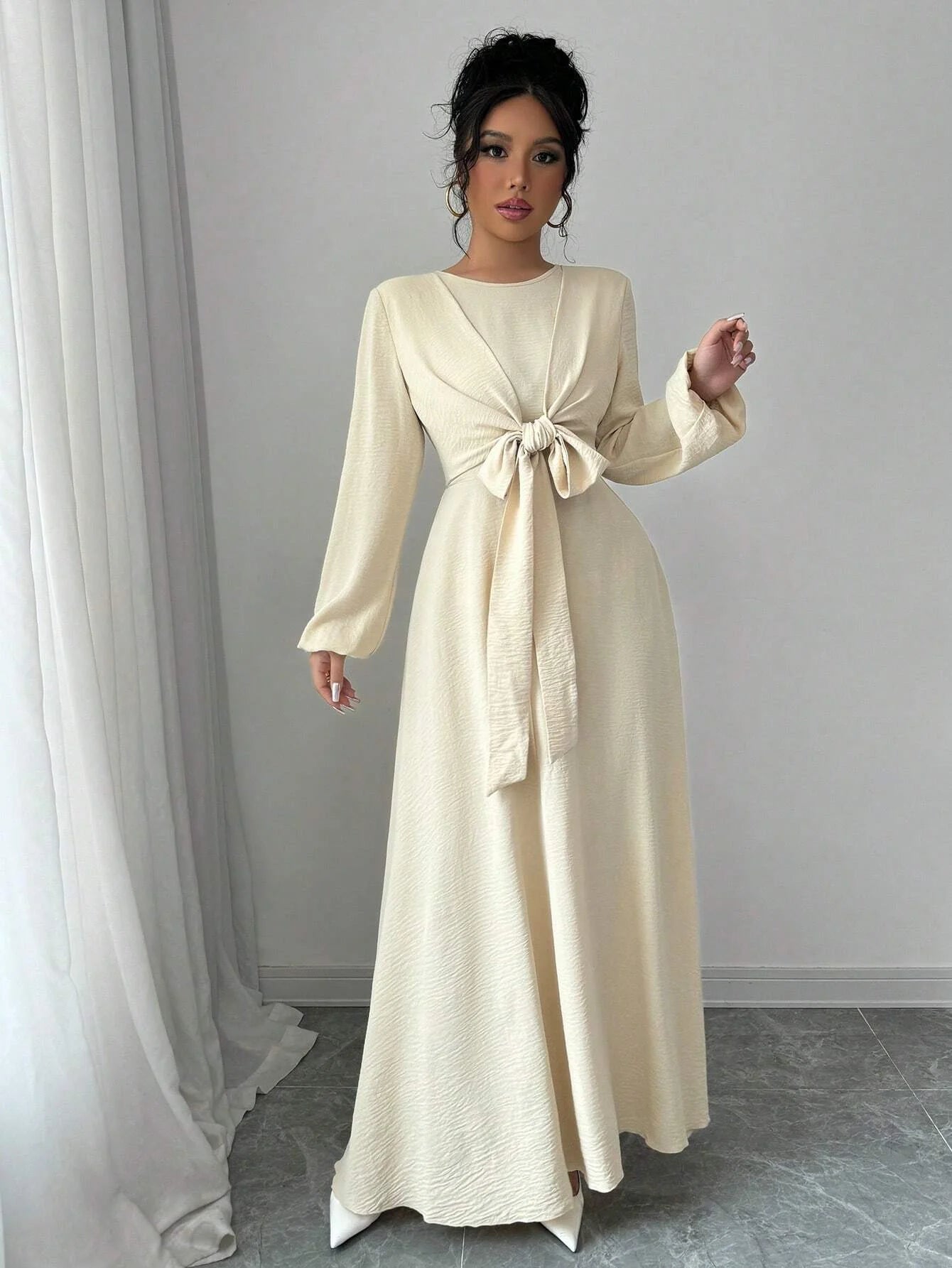 Trendy Modest Dress in Cream Tone Cross Neck and Waist Binding Design Great for Modern Islamic Women's Daily and Occasional Wear
