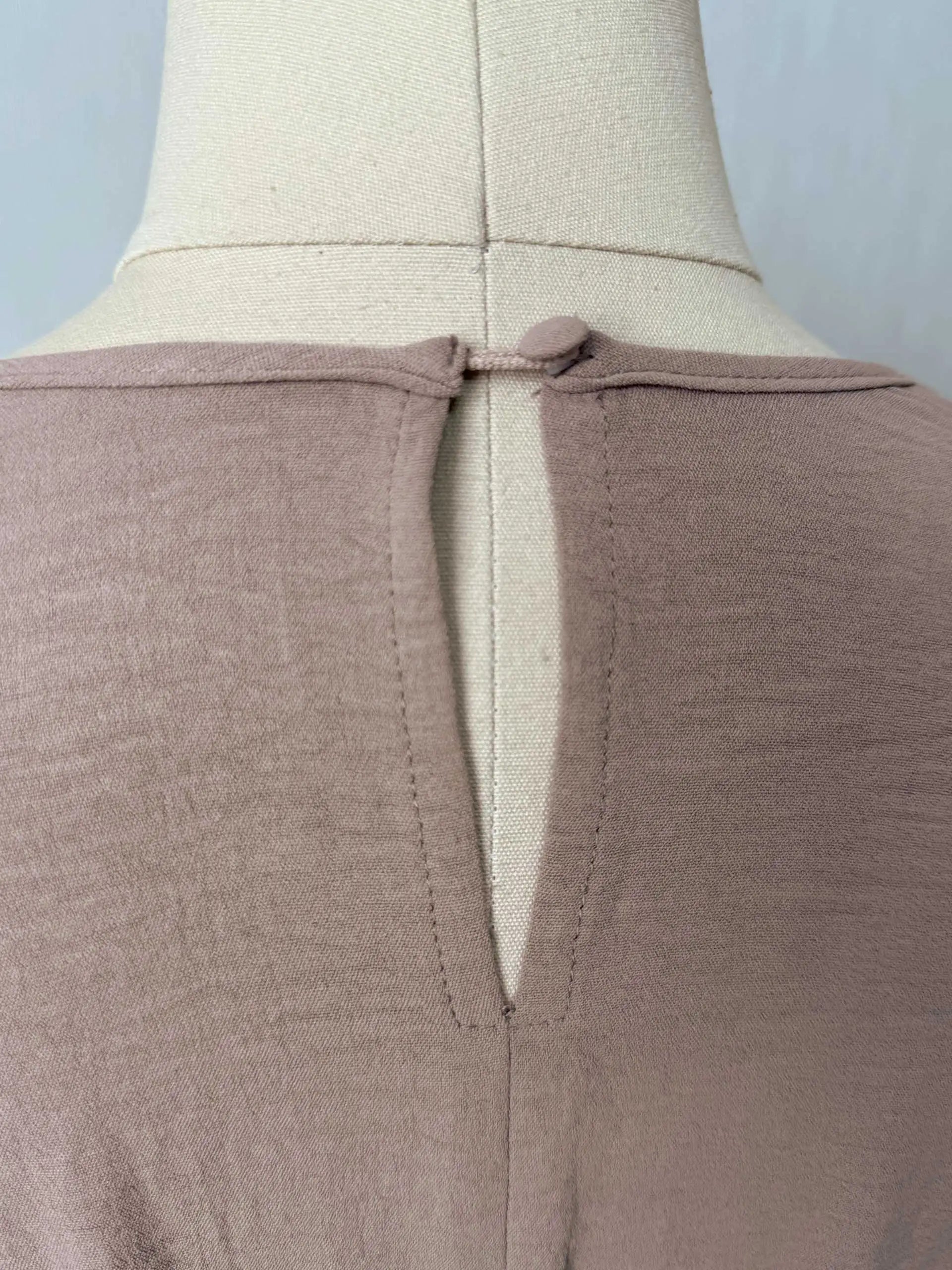 Trendy Modest Dress in Cream Tone Cross Neck and Waist Binding Design Great for Modern Islamic Women's Daily and Occasional Wear