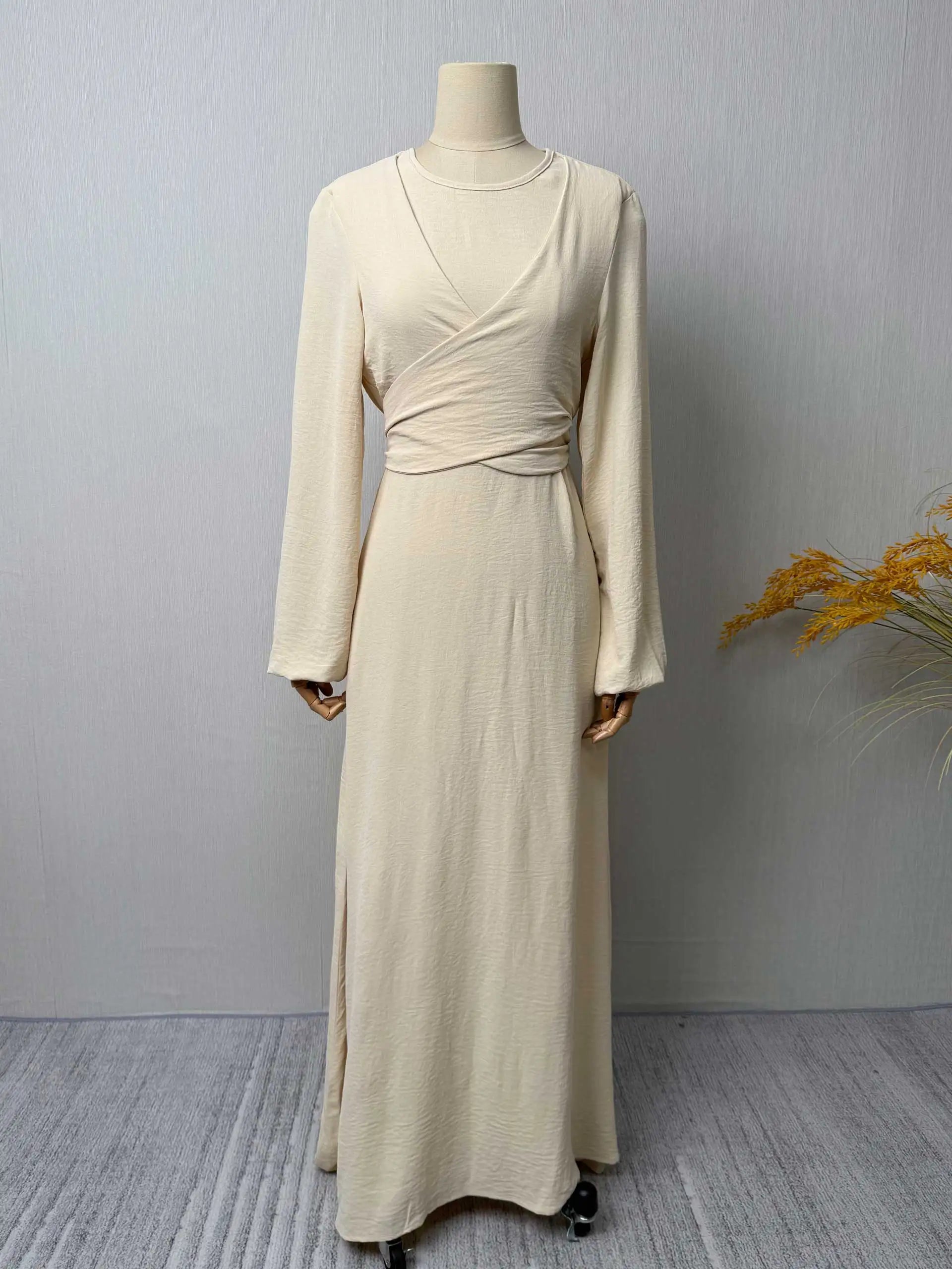 Trendy Modest Dress in Cream Tone Cross Neck and Waist Binding Design Great for Modern Islamic Women's Daily and Occasional Wear