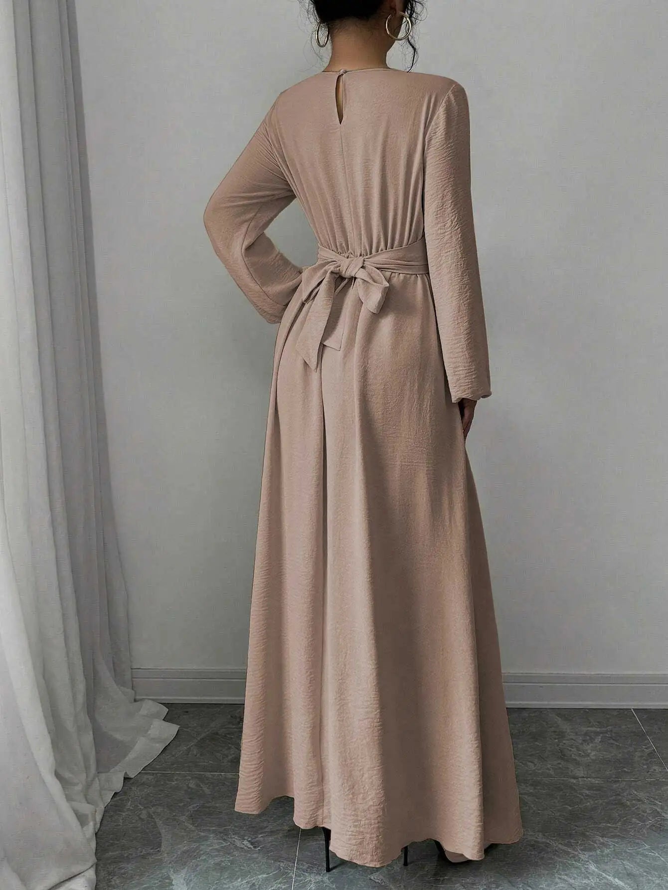 Trendy Modest Dress in Cream Tone Cross Neck and Waist Binding Design Great for Modern Islamic Women's Daily and Occasional Wear