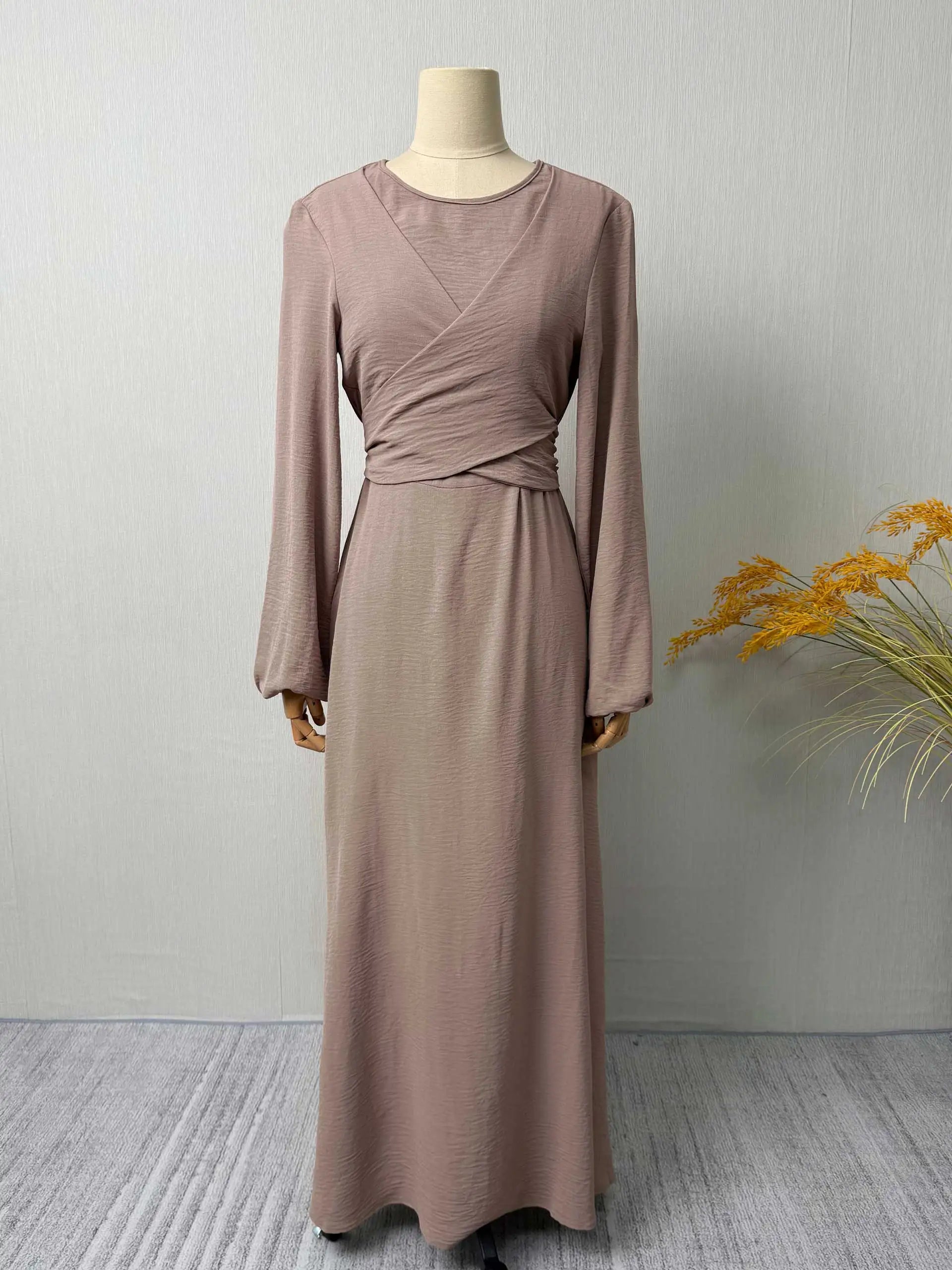 Trendy Modest Dress in Cream Tone Cross Neck and Waist Binding Design Great for Modern Islamic Women's Daily and Occasional Wear